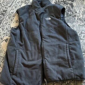 The North Face Charcoal Fleece Vest. Reversible. Never worn.